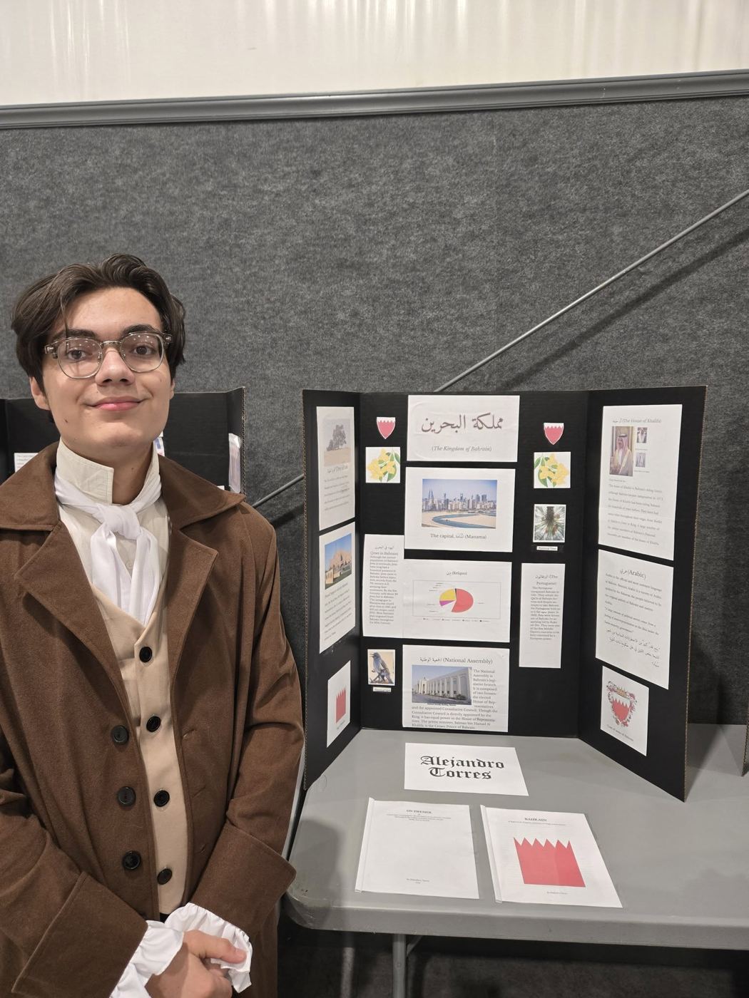 Student presenting a research display board
