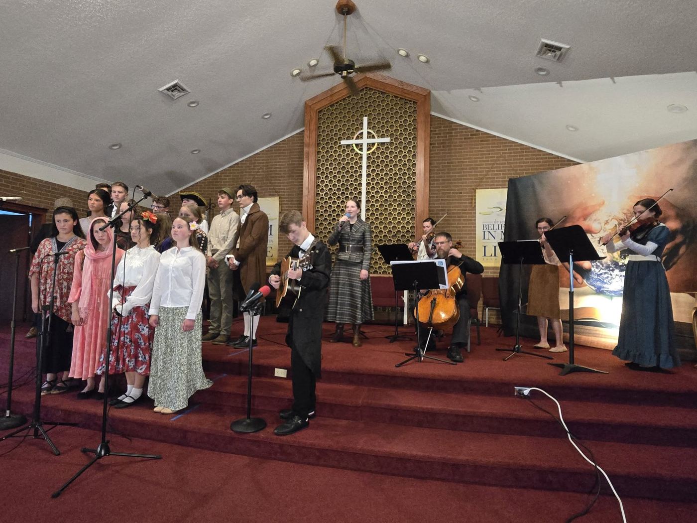 Choir and string players performing at the spring program